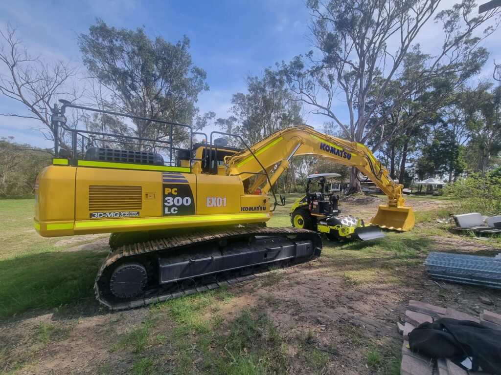 RM CIVIL HIRE Excavator Doing Work in Grass Area